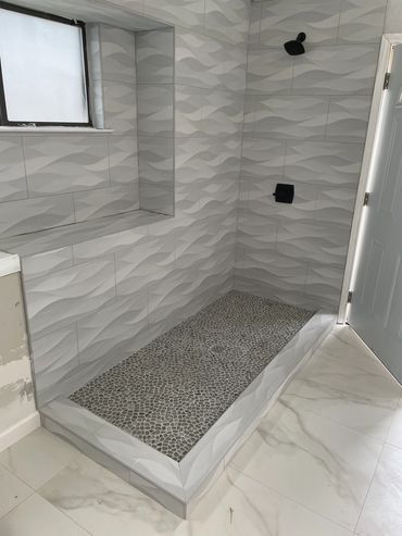 Wavy tile shower installation