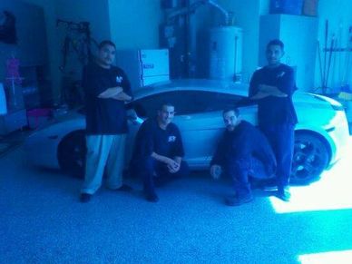 4 movers posing for a photo in front of customers cool vehicle. Portland Movers Ready.