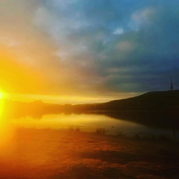 A gorgeous sunset bedside Canberra's Telstra Tower, Black Mountain and Lake Burley Griffin