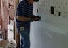 Mr. Sam cutting drywall at one of our commercial jobs
