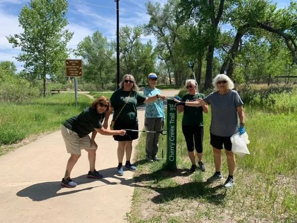 Group of five people on Cherry Creek Trail on a sunny day.