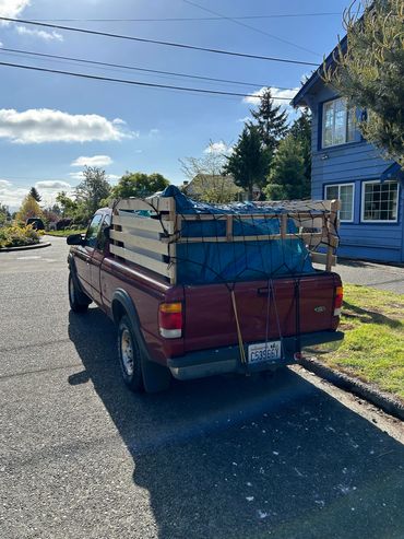Small Junk Haul's work truck parked and ready to haul