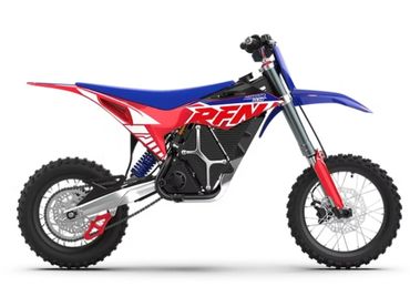 Red, blue, and white off-road dirt bike with knobby tires and suspension.