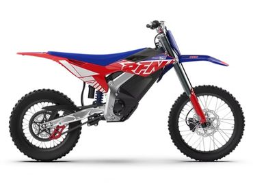 Red, blue, and black off-road dirt bike with knobby tires.