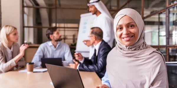 Smiling professional woman working diverse business team collaborating Dubai leadership inclusion