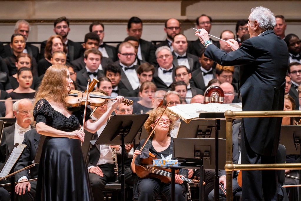 Maestro David Amram conducting his own "Elegy for Violin and Orchestra" at Carnegie Hall in 2019 wit