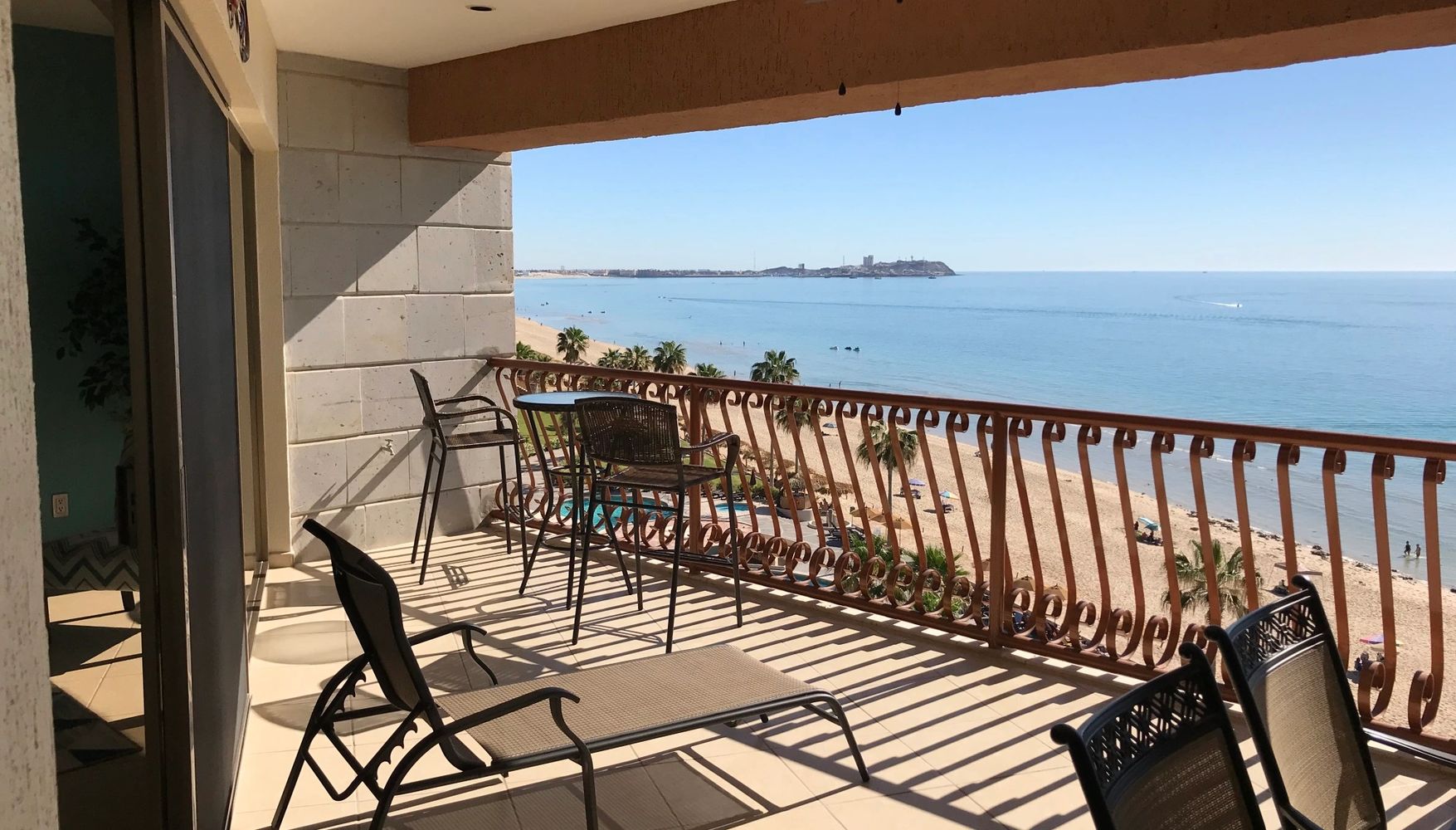view of the ocean from balcony of condo