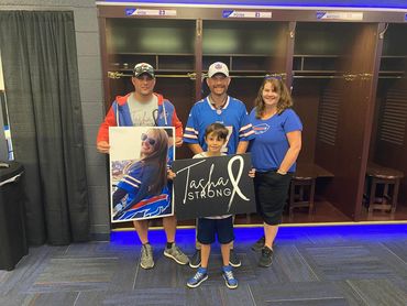 Tasha Strong Family Standing in Football Locker Room.