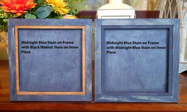 Two wooden frames stained in midnight blue, one with a black walnut inner piece and the other fully midnight blue.