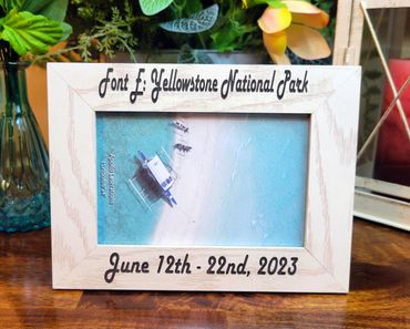 Wooden photo frame with Yellowstone National Park and dates engraved.