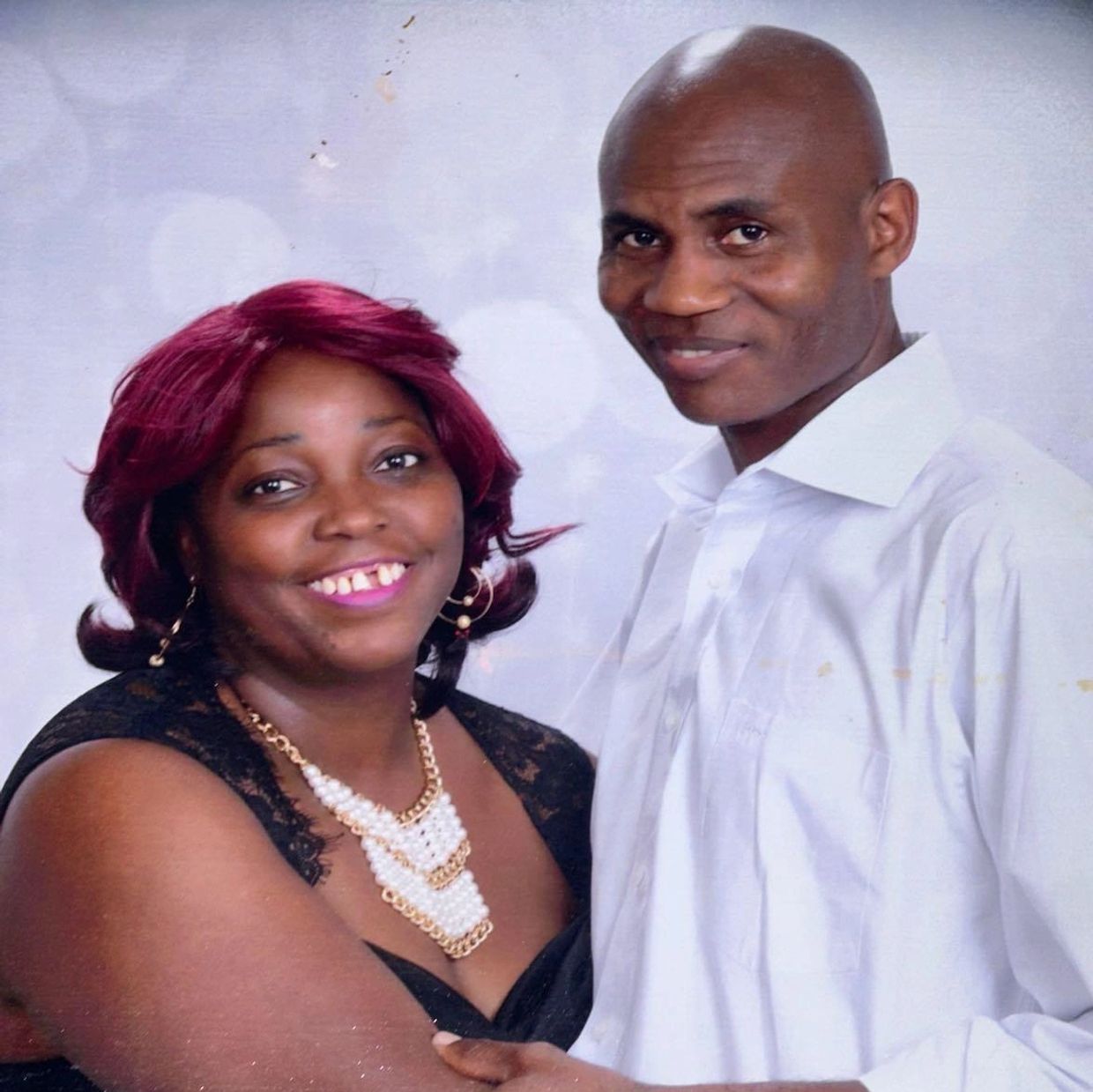 Happy couple posing together for a portrait.