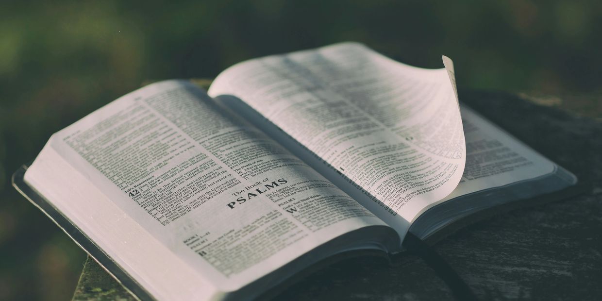 Open Bible showing the Book of Psalms.