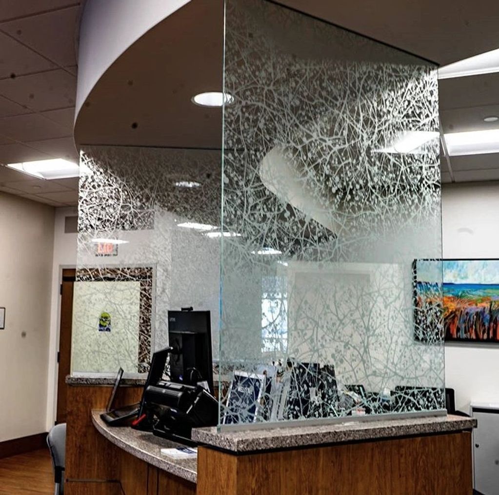 Newly installed custom glass partitions in an office