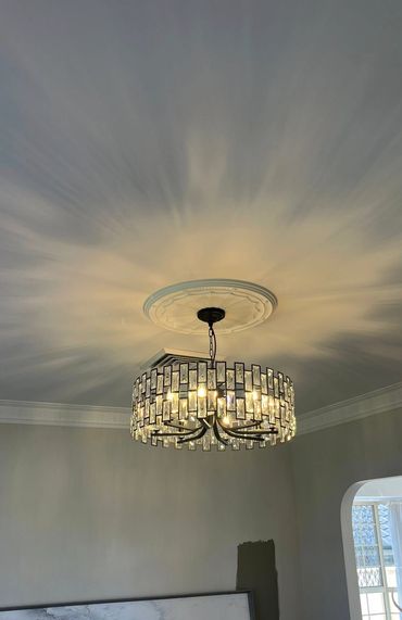 Decorative chandelier lighting installation with ceiling feature in Newcastle NSW
