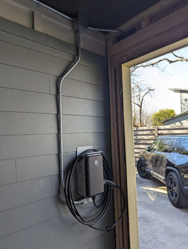 Rivian Wall Charger installed with external conduit