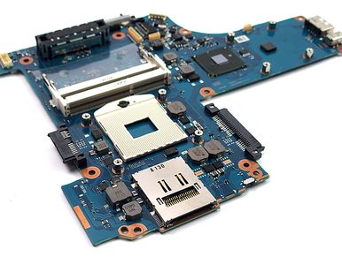 Blue printed circuit motherboard with various electronic components and ports.