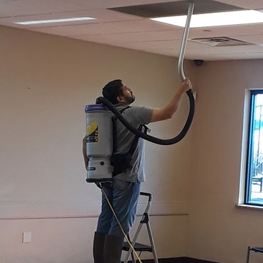 Vacuuming and cleaning ceiling vents.