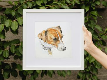 A small watercolour painting of a Jack Russell held in a square, white frame to emphasise the size