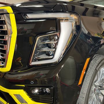 Headlight of black car