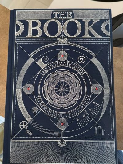 Cover of 'The Book: The Ultimate Guide to Rebuilding Civilization' with intricate geometric design.