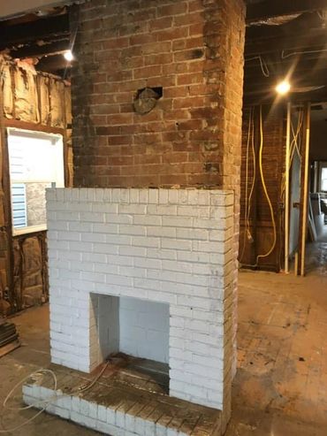 Brick Fire Place inside a home being remodeled.