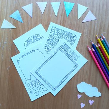 Coloring pages and pencils for kids crafting.