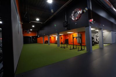 empty gym with turf and equipment