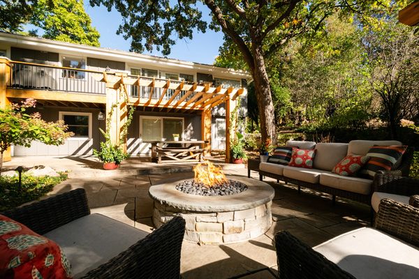 gas fire pit, stone patio, cedar pergola