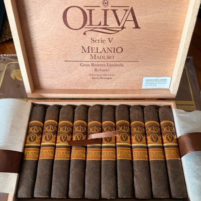 Box of Oliva Serie V Melanio Maduro cigars neatly arranged.