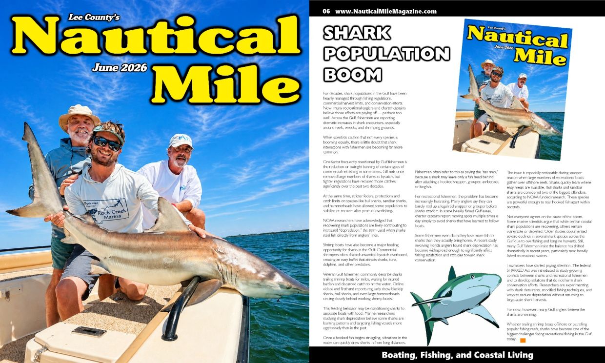 Three men on a boat proudly holding a large shark under a bright blue sky.