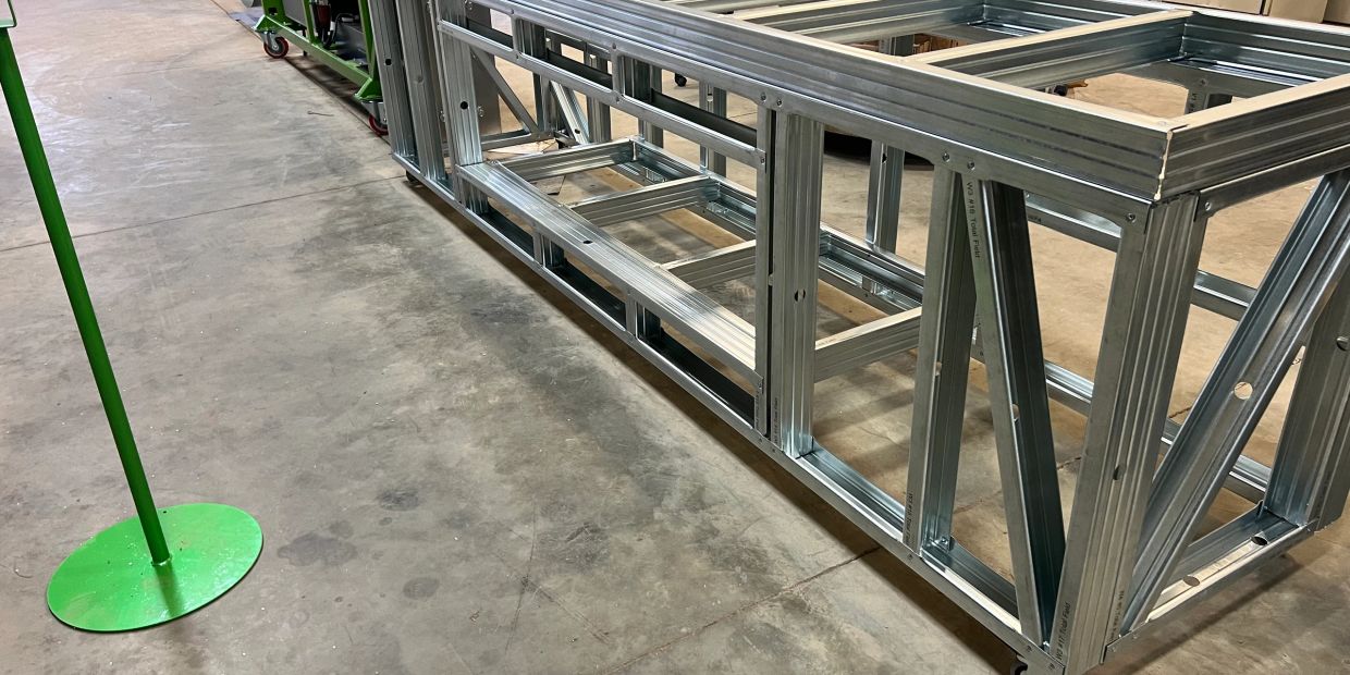 Large metal frame structure in a workshop.