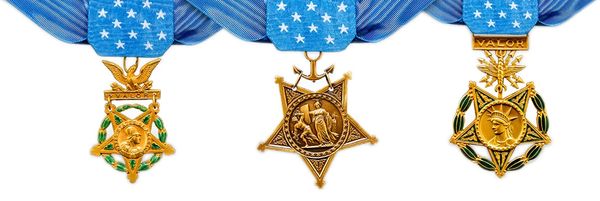 Three distinct U.S. military medals of honor with blue star ribbons.