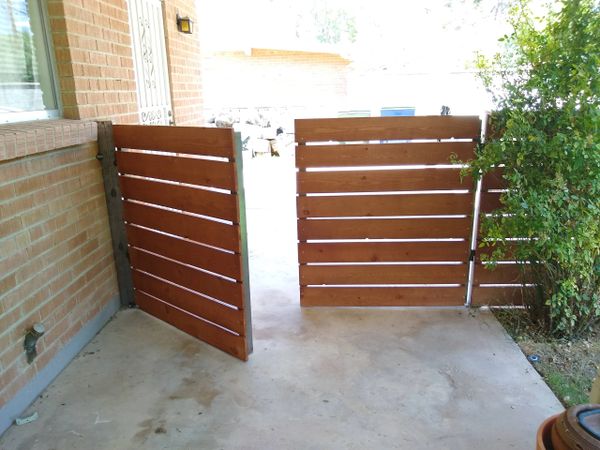 Lumber 
Natural wood fence 
Metal gate and fence  frame 

