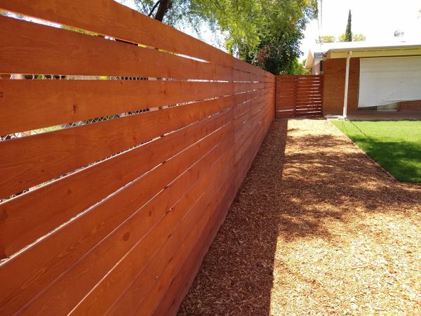 Lumber 
Natural wood fence 
Metal gate and fence  frame 

