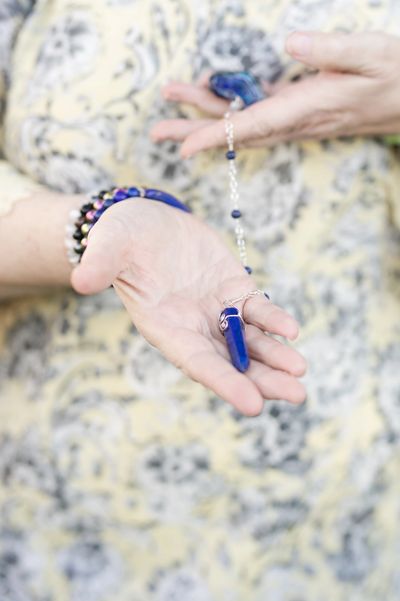 Mary Beth Wood holding a pendulum