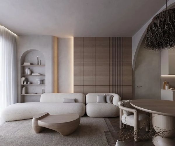 Modern minimalist living room with neutral tones and organic shapes.