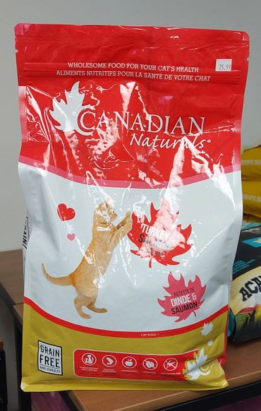 A bag of Canadian Naturals grain-free cat food with turkey and salmon flavor.