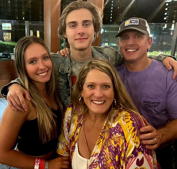 A family of four: mother and father and a daughter and son