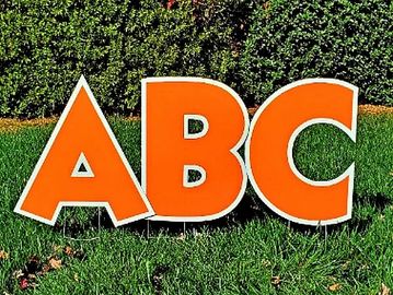 Bright orange yard card letters, big orange yard sign letters, huge orange happy birthday letters