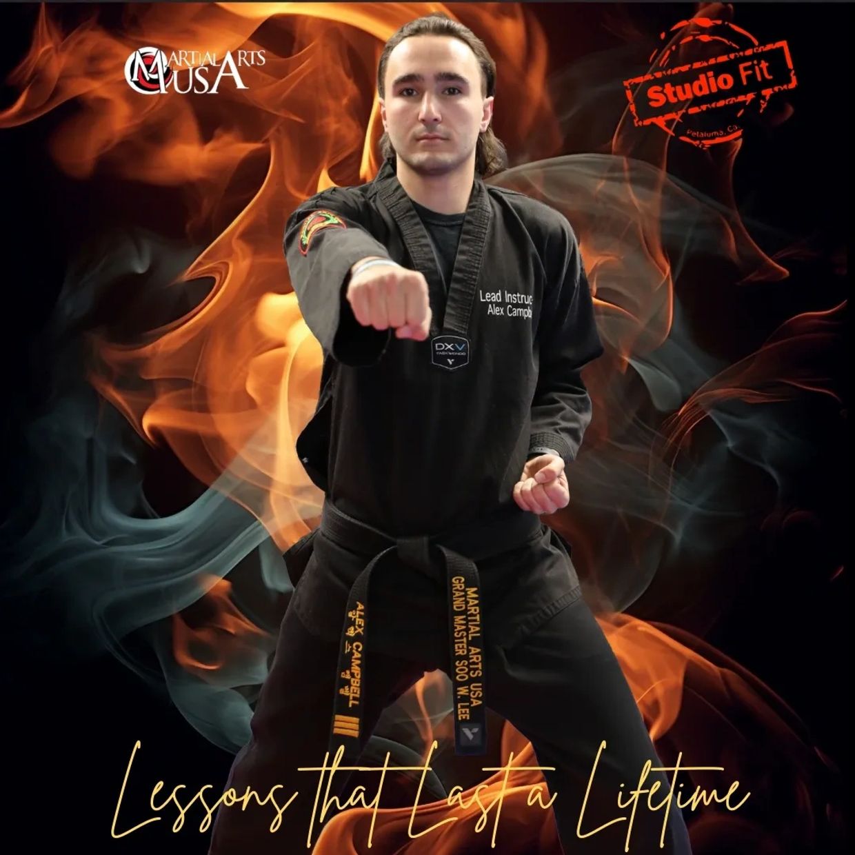 Martial arts instructor in black uniform with fire background.