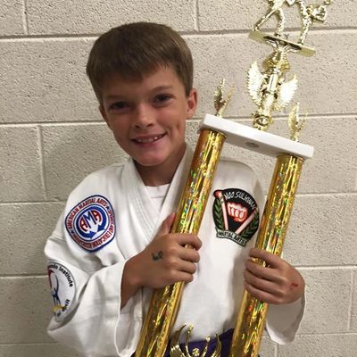 Youth karate student after taekwondo tournament.