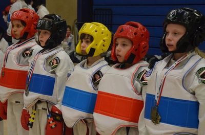 Youth Karate students getting ready for taekwondo sparring tournament