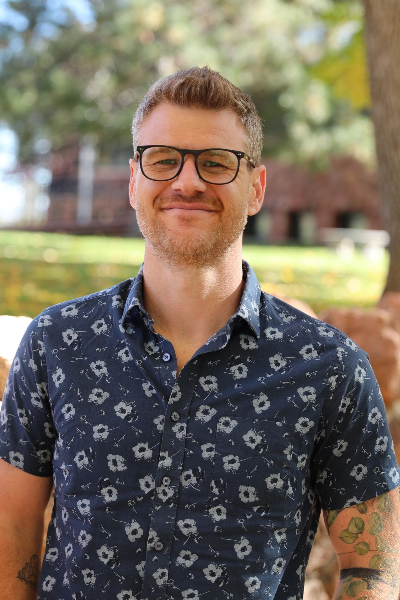 Dr. Claypool headshot - standing in nature.