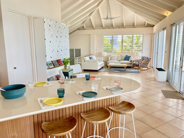 Modern open kitchen and living room of Las Piedras vacation rental in vieques, pr