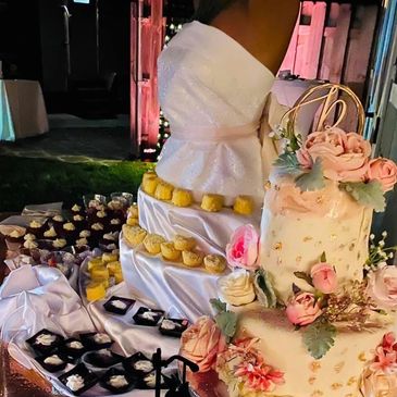 Picture of custom cake and dessert table.