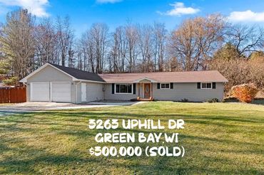 Single-story house with attached garage and large front yard in Green Bay, WI.