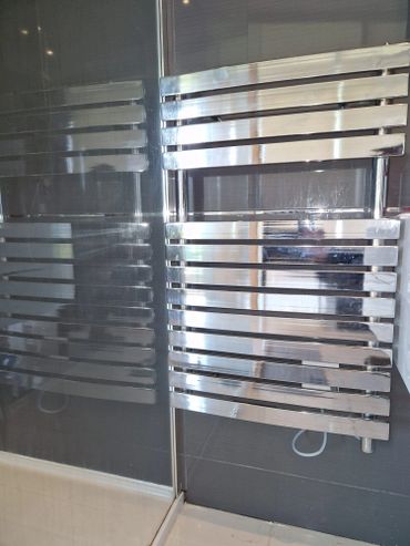 Electric radiator bathroom installation.