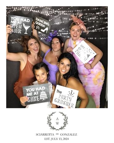 Guests enjoying a photo booth rental near me at a wedding reception in Westchester, NY.