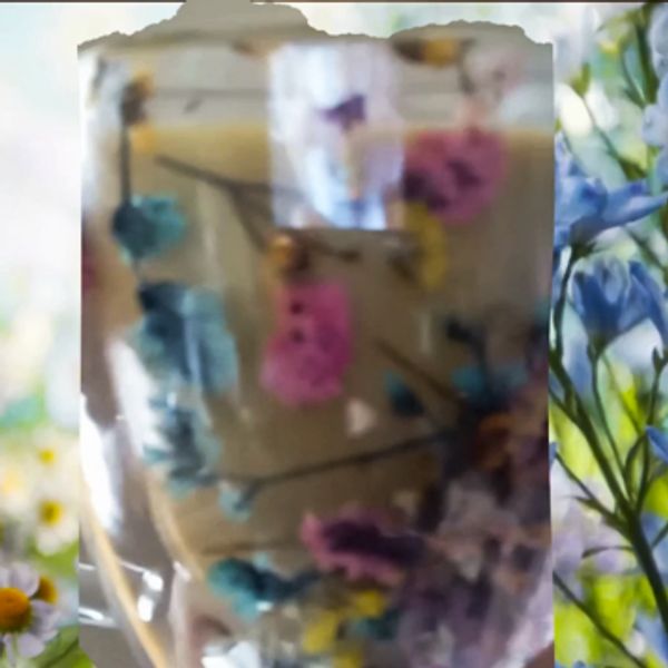 A glass jar with colorful dried flowers inside.