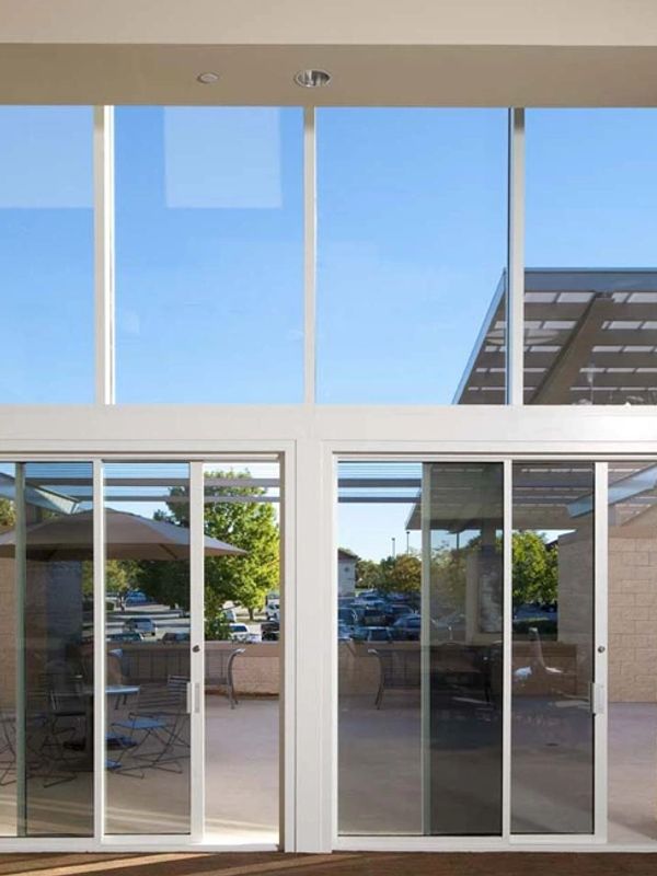 Commercial sliding glass doors opening to a patio.